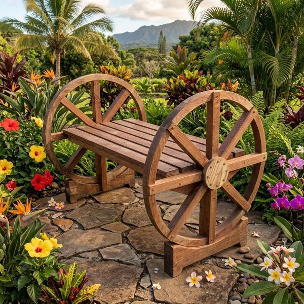 A rustic wooden bench designed like a water wheel, situated on a stone pathway in a lush tropical garden with flowers and palm trees.